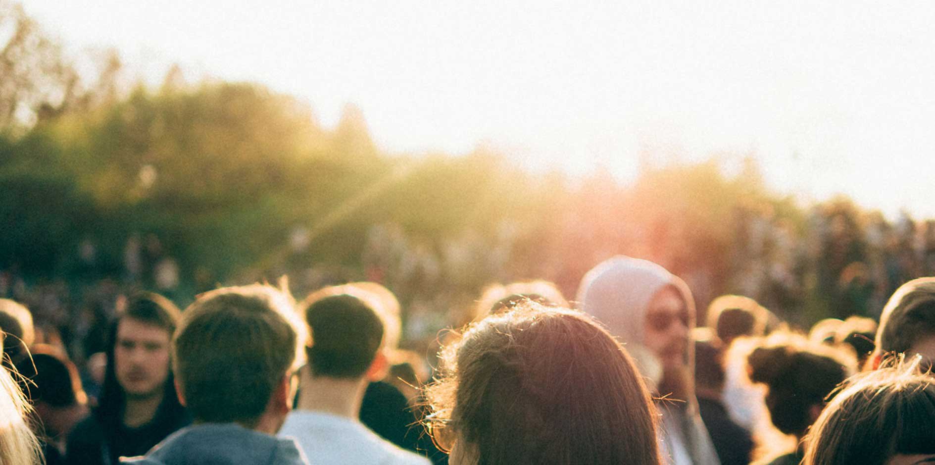 Crowd of young people at sunset