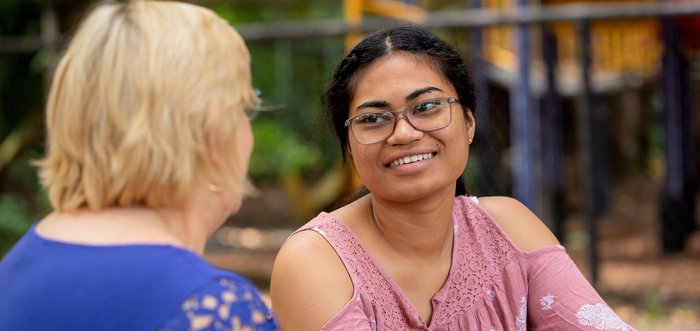 woman smiles at friend
